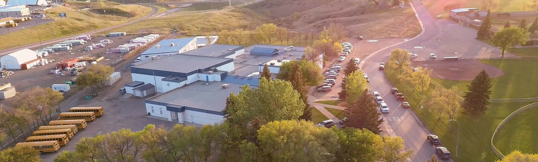 ICSS building drone aerial photo sunset coulees building busses